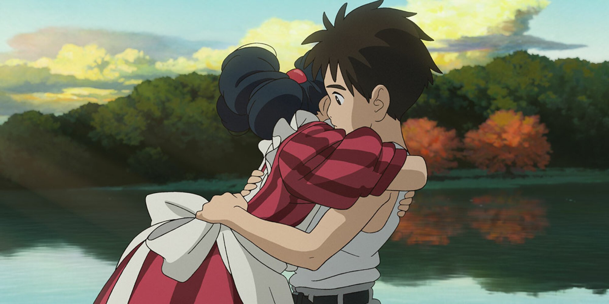 A boy and girl hug in "The Boy and the Heron."